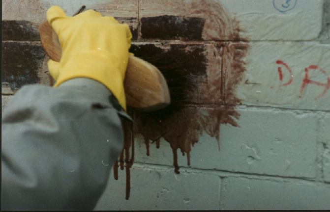 Masonry Wash being removed with a scrubbing brush